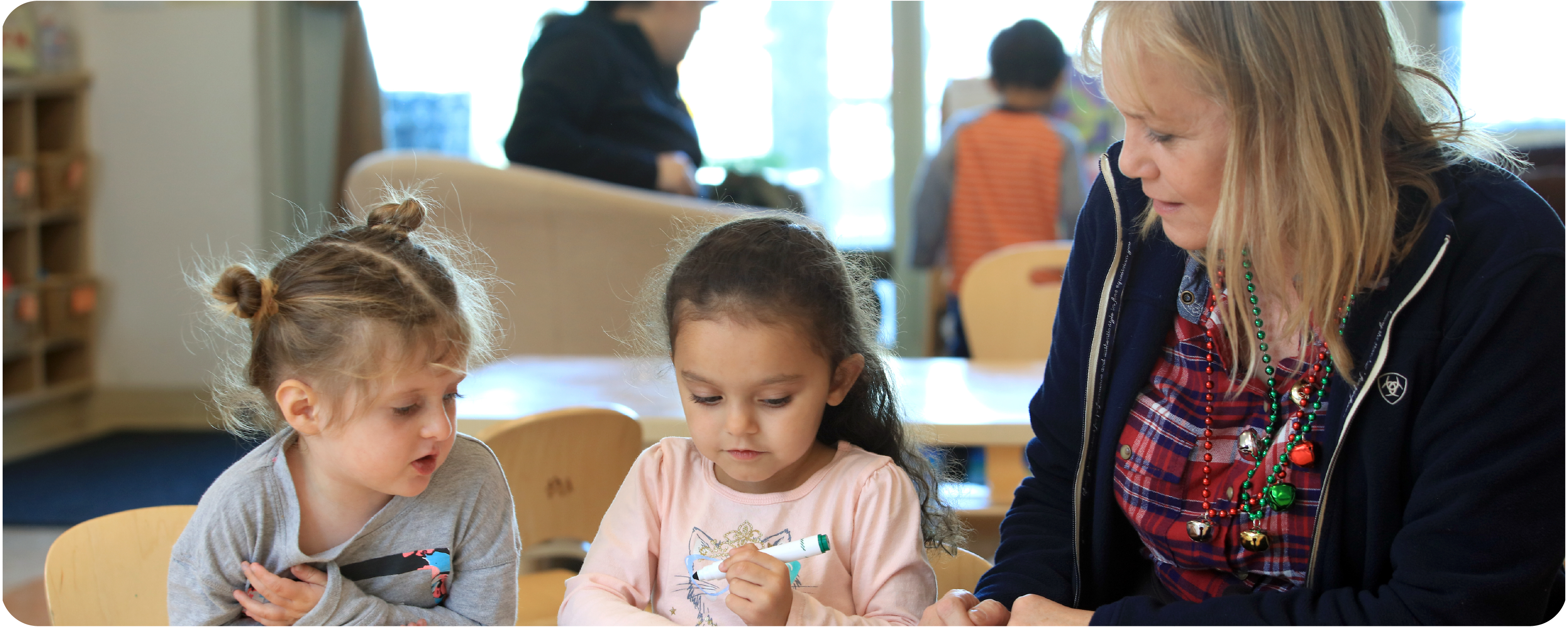 Two Little Lobos Academy Students with Teacher Two Little Lobos Academy Students with Teacher
