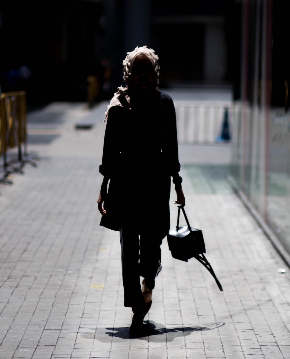 Person Walking at Night on Campus