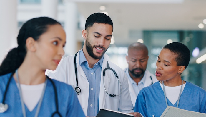 Doctors Walking in Hospital Hallway