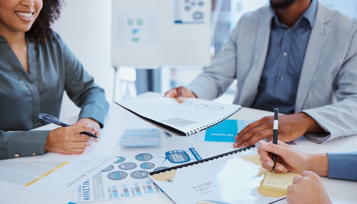 business employees sharing notes with each other