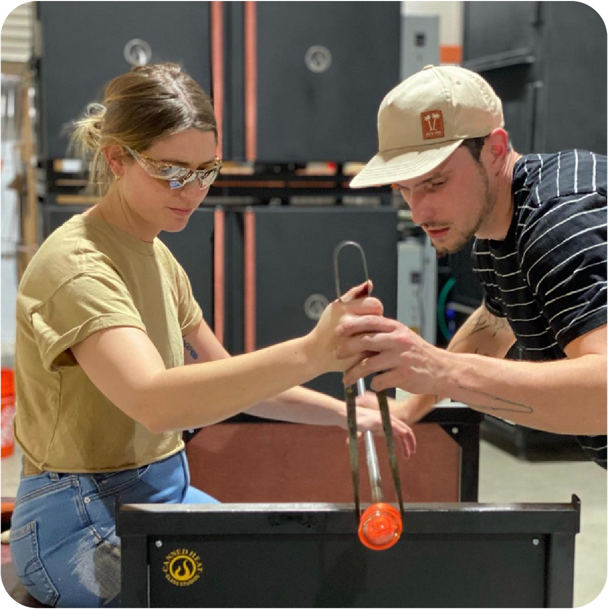 Glass Blowing Instructor Assisting Student Glass Blowing Instructor Assisting Student