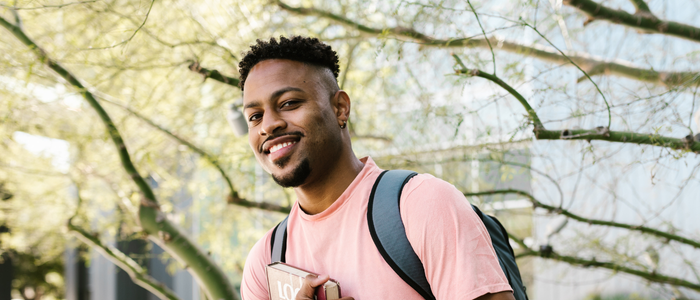 Student outside with backpack