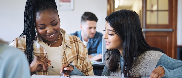 Two college students registering in class