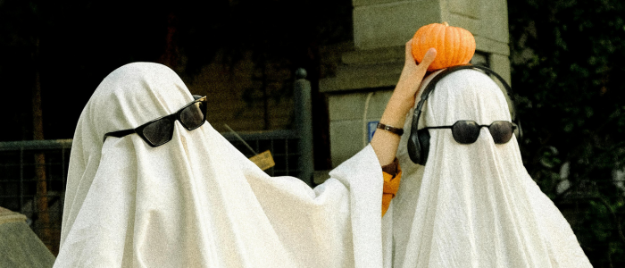 two people in ghost costumes with sunglasses on
