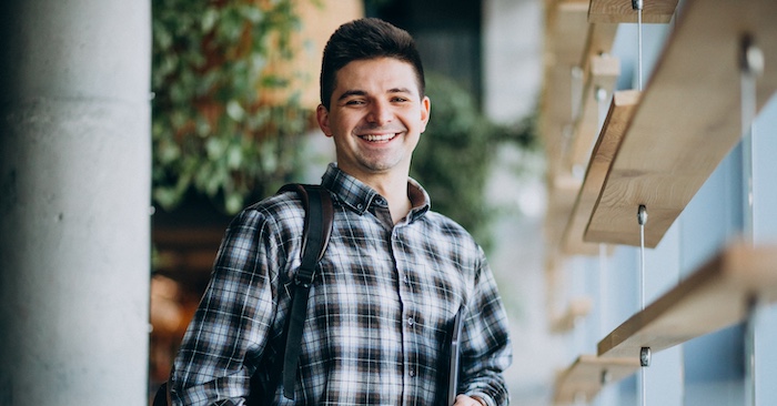 college student posing outside of class