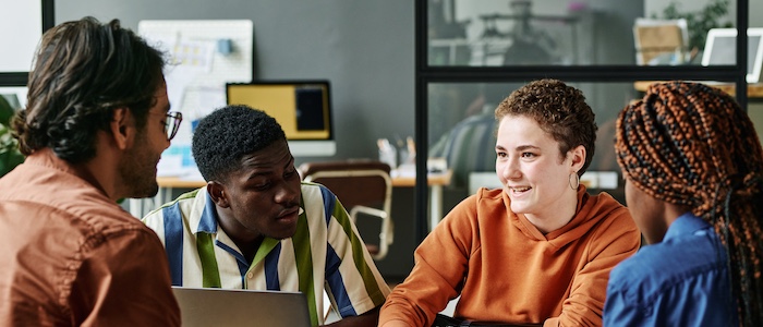 Interns Discussing Together at Work