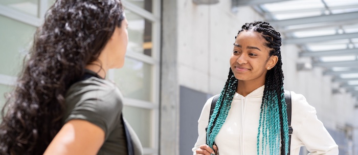 Two Black Students Speaking Outside