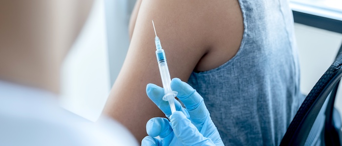 Doctor About to Administer a Shot