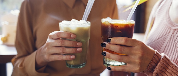 Two Friends Holding Iced Coffee