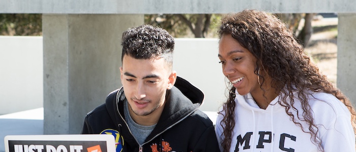 Two Students Working Together on Computer