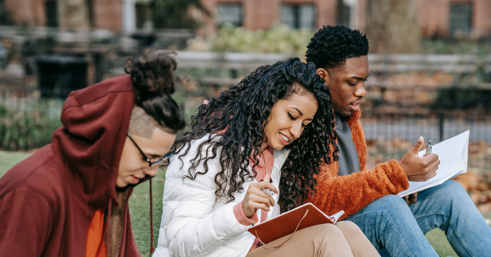 Students on campus reading together