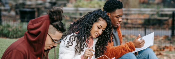 Students on campus reading together