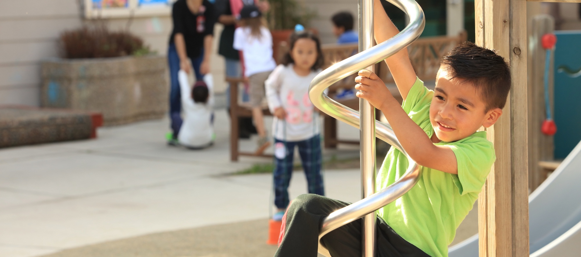 Lab School Student Playing on Jungle Gym