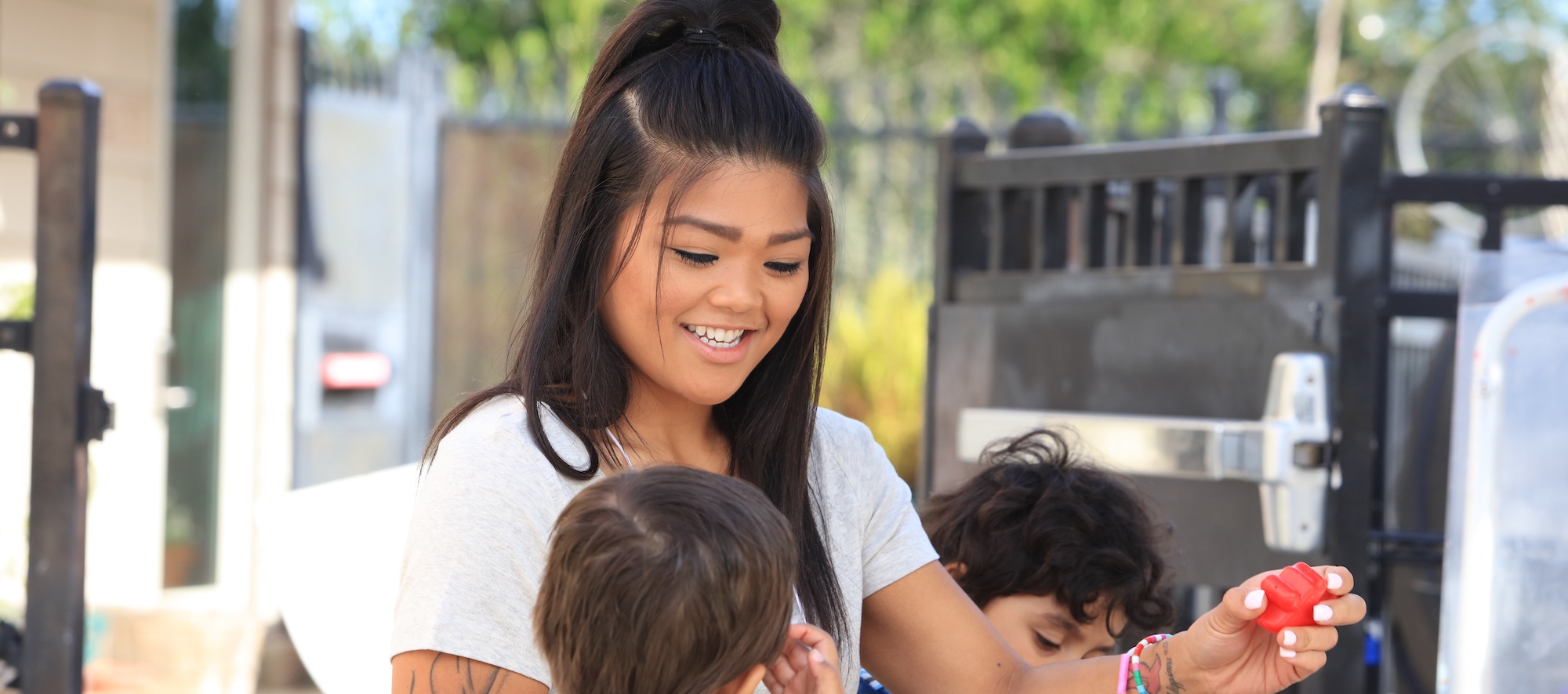 ECE Lab Student Working with Young Students