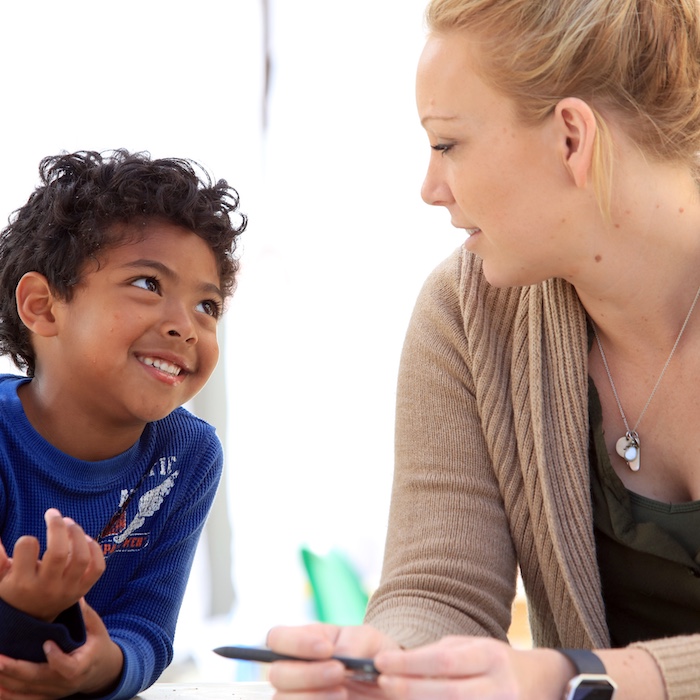 Little Lobos Academy Student Teacher with Young Child
